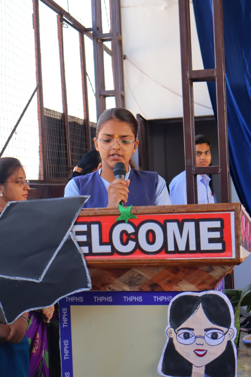Student giving welcome speech at the podium